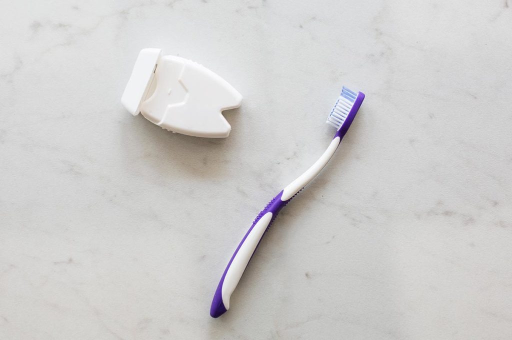 Dental floss and toothbrush